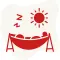 A red and white icon depicting a person lying in a hammock, relaxing under a bright sun.